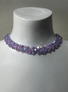 Genuine crystal, genuine crystal choker, chic, luxury jewelry, women, fashion, purple ab2x A color easy to tune, bright, to wear in any situation! Length to the clasp: 30 cm + 5 cm of chain Width: 0.8 cm Material: crystal, rocailles, stainless steel primers guaranteed without nickel We call crystal, the glass whose refractive index is equal or higher than 1.545. Unlike glass, crystal has more clarity, more brightness. Purple Necklace Crystal, Purple Beaded Crystal Necklaces For Party, Elegant Handmade Purple Crystal Necklaces, Luxury Purple Elegant Crystal Necklaces, Elegant Purple Beaded Crystal Necklace, Crystal Neckless, Purple Jewelry Necklace, Violet Accessories, Elegant Purple Crystal Rhinestone Necklace