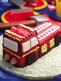 a cake shaped like a firetruck on top of a table