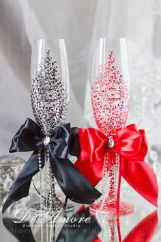 two wine glasses with bows on them