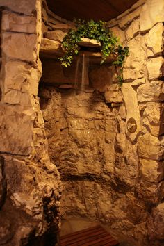 a stone wall with a water fall in it