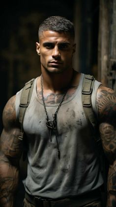 a man with tattoos on his arms and chest