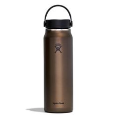 the hydro flask water bottle is shown in gold and black, with an insulated lid