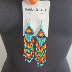 This is a lovely pair of boho chandelier earrings made from beads Nice beaded work in bright colours Very bohemian Have rubber stoppers Shipping is registered and tracked.i can combine shipping for multiple items Handmade Rainbow Beaded Bohemian Earrings, Bohemian Rainbow Beaded Round Earrings, Rainbow Beaded Bohemian Earrings, Rainbow Bohemian Beaded Drop Earrings, Multicolor Hand-strung Bohemian Beaded Earrings, Chandelier Boho, Boho Chandelier, Beaded Work, Handmade Chandelier