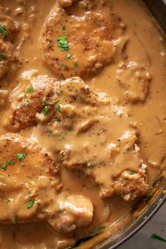 some meatballs and gravy in a pot