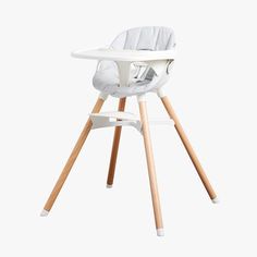 a white high chair sitting on top of a wooden table