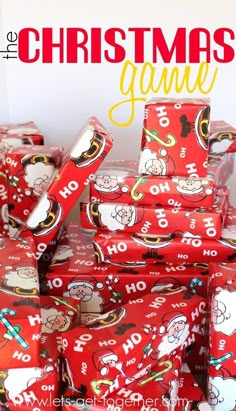 a pile of red wrapped presents sitting on top of each other