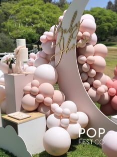 an outdoor event with balloons and decorations