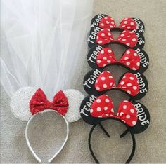 three mickey mouse ears and one minnie mouse headband