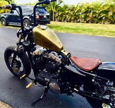 a black and gold motorcycle parked on the street