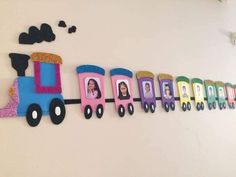 a colorful train is hanging on the wall