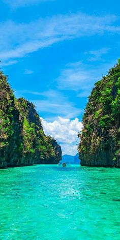 the water is crystal blue and green with rocks on both sides that look like they are floating in the ocean