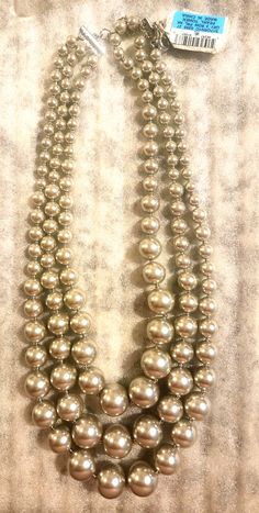 As shown triple strand silver gray colored pearls  ( not genuine pearls ) Adjustable clasp Bought in Macy's never worn Comes in gift box! Colored Pearls, Pearl Gifts, Pearl Grey, Pearl Color, Gift Tags, Pearl Necklace, Gray Color, Silver Necklace, Gift Box