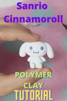 a person holding a small toy in their hand with the text sanrio cinnamoroli polymer clay