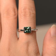 This is a gorgeous handmade creation. Its beauty is its simplicity & Elegance. The 6*6mm princess cut green sapphire is crafted in solid sterling silver / 14k gold. It is available to customized, if you have any mind, just let me know, we will discuss with it. All item is sent in a beautiful gift box You can realize more lovely stuff clicking the link https://www.etsy.com/shop/knightjewelry?refshopsection_shophome_leftnav Please leave the correct address and you PHONE NUMBER for delivering s Princess Cut Emerald Jewelry, Emerald Solitaire Princess Cut Jewelry, Princess Cut Emerald Solitaire Jewelry, Promise Princess Cut Birthstone Ring, Sterling Silver Square Cut Emerald Ring For Anniversary, Princess Cut Emerald Ring For Promise, Princess Cut Emerald Promise Ring, Formal Princess Cut Emerald Ring, Sterling Silver Emerald Ring Princess Cut