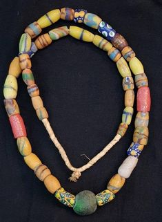 Its Beautiful Lovely Color of Ancient African Beads Wonderful Old Necklace it used to be called tribal Beads like in past they used instead of money Length 52cm Artisan Beaded Necklaces For Festivals, Amulet Necklaces With Large Oval Beads, Amulet Style Wooden Beaded Necklace, Colorful Beads Amulet Jewelry, Amulet Style Large Beads For Festivals, Colorful Beaded Amulet Style Jewelry, Amulet Style Beaded Necklace With Round Wooden Beads, Amulet Style Beaded Necklace With Large Oval Beads, Amulet Style Jewelry With Colorful Round Beads