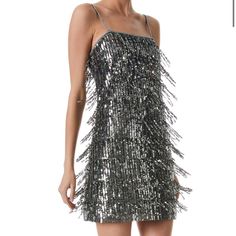 The Chicago Minidress From Alice + Olivia Features A Straight-Neck Sheath Silhouette Embellished With Sparkling Sequined Fringe. Metallic Spaghetti Straps And An Exposed Back Zip Closure Complete The Look. Straight Neck Spaghetti Straps Exposed Back Zip Closure 100% Nylon Lined Dry Clean Imported The Fringe Is Sequin And Beaded And Is Su Beautiful And Sparkly! A Must Have For Your Holiday Festivities Or New Year’s Eve Party! Flirty And Flashy. Also Perfect For Pageant Pic Or Opening Number And P Sleeveless Embellished Metallic Mini Dress, Metallic Embellished Sleeveless Mini Dress, Embellished Sleeveless Metallic Mini Dress, Metallic Embellished Mini Dress For Party Season, Silver Sleeveless Embellished Sequin Dress, Silver Embellished Sleeveless Sequin Dress, Embellished Metallic Mini Dress, Silver Embellished Sequin Dress For Holiday, Holiday Silver Embellished Sequin Dress