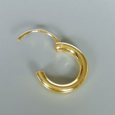 16 mm sterling silver endless ear hoops, dipped in gold. Size: 3 x 16 mm These earrings are made of real 925 hypoallergenic sterling silver, dipped in real gold. Will be packaged in a gift box. Please let me know if you don't want it in one. I can write out a message from you to the receiver if needed. Please be free to contact me at... bhavnakwintra1956@gmail.com More hoops: https://www.etsy.com/your/shops/TheSilverGame/tools/listings/section:26305414 More earrings: https://www.etsy.com/your/sh Simple Gold Huggie Earrings Tarnish Resistant, Simple Gold Small Hoop Huggie Earrings, Simple Gold Huggie Jewelry, Minimalist Small Hoop Earrings Cadmium-free, Simple Gold Huggie Earrings As Gift, Simple Gold Huggie Hoop Earrings, Gold Modern Hoop Cartilage Earrings, Simple Pierced Hoop Jewelry, Gift Minimalist Hoop Earrings