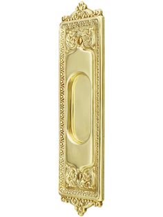 an ornate gold door handle on a white background