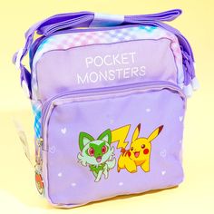 Take this kawaii shoulder bag on your daily travels! It showcases a cute illustration of Pokemon in front and a colorful gingham pattern on the sides. The bog has a smaller outer pocket so you can easily organize your stuff. It also features a Pokeball acrylic charm for added cuteness! Comes with an adjustable strap Kawaii School Bag With Pockets, Kawaii Travel Bag With Pockets, Cute Travel Shoulder Bag With Pockets, Kawaii Shoulder Bag For Back To School Travel, Harajuku Style Multicolor Shoulder Bag For School, Kawaii Purple Shoulder Bag For Travel, Purple Kawaii Shoulder Bag For Travel, Nintendo Characters, Gingham Pattern