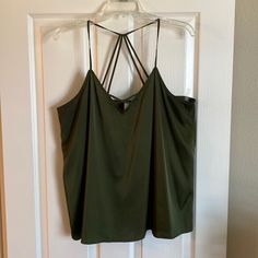 Silky Material Army Green Cami/Tank Top. Racer Back Style Back That Has 4 Connection Points To The Top. 97% Polyester. Armpit To Armpit Measures 19” Laying Flat. Only Warn A Couple Times. Like Brand New. No Flaws Or Stains. Smoke Free Home. Green Tank Top For Night Out, Green V-neck Tank Top For Night Out, Green Vest Tops With Tank Straps, Green Cami Top For Night Out, Green Cami Tank Top For Night Out, Green Cami Top For Day Out, Green Cami, Green Top, Green Tops