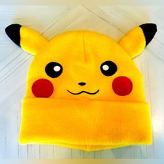 New Without Tags Never Worn - Stay Warm And Show Off Your Love For Pokmon With This Pikachu Beanie Featuring A Big Embroidered Graphic Of Pikachu’s Face On The Front. Complete With 3d Ears, This Beanie Is Both Playful And Practical. Made From Acrylic Yarn, It’s Designed To Fit Most Head Sizes Comfortably. For The Best Care, Hand Wash This Beanie In Cold Water And Lay Flat To Dry To Keep The Pikachu Design Intact. Pikachu Beanie, Pokemon Accessories, Cuffed Beanie, Big Face, Acrylic Yarn, Stay Warm, Lay Flat, Pikachu, Cold Water