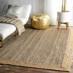 a bedroom with a large rug on the floor