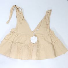 Brand New With Tag Petal + Pup Shirt Women's Us Size 8 Au Size 12 Beige Like Color, Sleeveless Tank Top, Straps Tie At Shoulders, Flowy Looser Style, Tiered Look, Deep V Neck 55% Linen 45% Cotton Cute Beige V-neck Top, Solid Tops With Ruffles For Summer, Solid Ruffled Tops For Summer, Solid Color Ruffled Tops For Summer, Beige Ruffled Tank Top For Summer, Ruffled Tops For Vacation, Feminine Solid Color Tops For Vacation, Ruffled Tops For Beach, Feminine Tops For Vacation