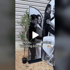 an outdoor photo booth is decorated with black and white photos, which include a couple kissing each other