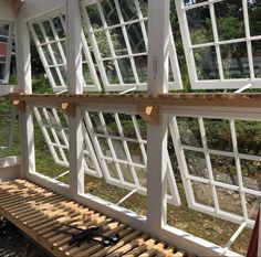 a bench made out of wood and windows