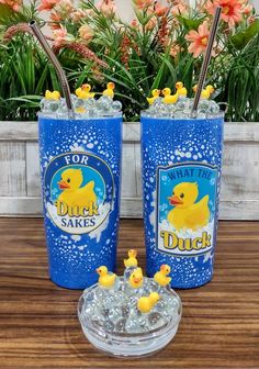 two blue tumblers with rubber ducks on them