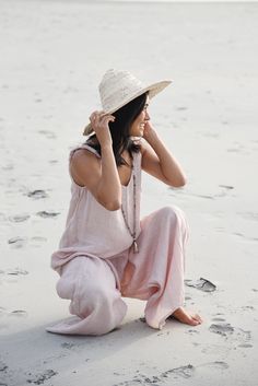 Style // A fresh blush linen jumpsuit, the perfect shade for any occasion. The true timeless essential for the never ending Summer. An effortless jumpsuit made from 100% linen, a companion to take with you no matter where you go! Soft linen, detailed straps and flows in all the right ways! Perfect for the easy breezy mama... Yes, you can wear it pregnant too! Made in Italy from 100% Linen. One size fits most. Measurements // Bust: 20" Inseam: 23" For EVERY Jumpsuit sold, Beachwood Baby we will P Summer Beach Linen Jumpsuits And Rompers, Feminine Summer Beach Jumpsuits And Rompers, Pink Overall Jumpsuit For Beach, Pink Beach Overalls Jumpsuit, Pink Beach Overall Jumpsuit, Linen Jumpsuit, Pink Linen, Easy Breezy, Panama Hat