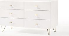 a white dresser with gold handles and drawers