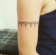 a woman with a tattoo on her arm