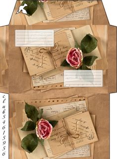 two envelopes with roses on them and some letters attached to the back of them