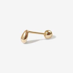 Go with the flow in this perfect stud. Jack's minimal design makes this piercing ideal for every day wear. Pairs well with all your piercings and earrings and is designed to add a sleek, chic edge to your everyday vibe. Created for you in 14 karat solid gold, this single piercing can stay in your ear always, even when you are in the water. Minimalist Teardrop Piercings For Everyday, Elegant Hypoallergenic Teardrop Piercings, Minimalist Single Earring For Everyday, Minimalist Single Earring For Everyday Wear, Minimalist Teardrop Ear Piercings, Gold Teardrop Minimalist Piercings, Everyday Minimalist Pierced Nose Studs, Modern Yellow Gold Piercings For Everyday, Minimalist Internally Threaded Nose Studs For Everyday