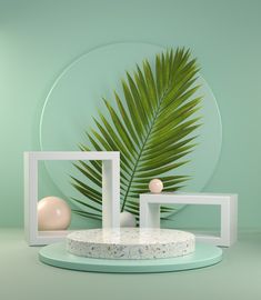 there is a palm leaf in the background and two white vases with balls on them