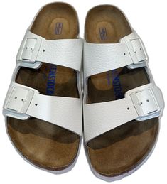 White Leather Footbed Slip-on Sandals, Classic Slide Footbed Sandals For Beach, Classic Slides With Textured Footbed For Vacation, Classic Footbed Sandals For Spring Beach, Classic Spring Beach Footbed Sandals, Classic Footbed Sandals For Beach In Spring, Classic Beach Slides With Buckle Closure, Vacation Leather Footbed Sandals With Round Toe, Classic Beach Slides With Flat Heel