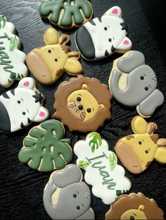 many decorated cookies with animals on them