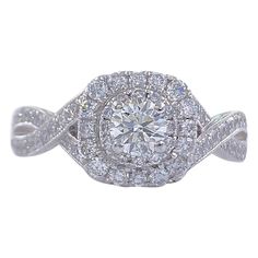 Neil Lane Bridal Style: Double Halo & Twisted Band Engagement Ring SKU Number: #940447410 Metal: 14K White Gold Size: 5.25 sizable Total Carat Weight: 7/8 TCW / 0.87 tcw Center Diamond Shape: Round Brilliant Diamond 0.33CTS Accent Diamonds: Round Diamonds 66 Stones 0.54 TCW Diamond Color & Clarity: I / I1 Hallmark: "Neil Lane" signature "14kt " Includes: -Certified Appraisal -Elegant Ring Box Retail Value: $2,499.99 SKU#11500TSD070921 Twisted Band Engagement Ring, Neil Lane, Engagement Rings Twisted, Round Engagement Rings, Twisted Band, Round Diamond Engagement Rings, Band Engagement Ring, Elegant Ring, American Diamond