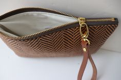 summer wristlet purse Everyday Clutch With Braided Handles, Brown Pouch Clutch With Braided Handles, Brown Clutch With Braided Handles For Everyday Use, Brown Leather Clutch With Braided Handles For Daily Use, Chic Brown Woven Clutch, Woven Clutch Pouch For Daily Use, Handwoven Brown Clutch For Travel, Brown Handwoven Pouch For Everyday Use, Chic Handwoven Clutch For Daily Use