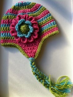 a crocheted hat with a flower on it