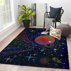 a room with a rug that has an image of the planets and stars on it