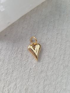 - heart charm - 16k heavy gold plated over brass - puff detail - approx 17mm - can select a ring with inner diameter of 5mm or 8mm Everyday Gold Plated Heart Charm, Handmade Gold Charms For Everyday, Handmade Gold Charms For Everyday Wear, Gold Heart Charm For Anniversary, Everyday Handmade Gold Charms, Heart-shaped Gold Plated Charms For Gifts, Yellow Gold Heart Pendant Charms For Everyday, Everyday Yellow Gold Heart Pendant Charms, Dainty Gold Heart Charms