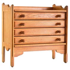 a wooden dresser with four drawers on one side