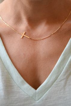 "I am obsessed with this necklace. I have been a long time fan of a classic gold cross necklace....a simple and classic daily wear. In my attempt to edge it up bit, I anchored a lovely Gold Filled Cross Pendant Sideways. The cross measures 9.5 mm by 17 mm (FYI-for reference 1 inch = 24.6 mm) and is strung on my Gold Filled Shimmer Bar Chain. So precious! Feminine and delicate, this is my go to necklace and the perfect gift. Also available with a bolder cross that measures 14.5 mm x 22.4 mm! Phot Minimalist Cross Chain Necklace With Delicate Chain, Minimalist Gold Chain Necklace With Cross Pendant, Minimalist Delicate Chain Cross Necklace, Minimalist Cross Pendant Necklace For Everyday, Minimalist Cross Pendant Necklace For Everyday Wear, Dainty Cross Necklace For Everyday Wear, Dainty Cross Necklace With Delicate Chain For Everyday, Minimalist Cross Necklace For Everyday, Dainty Everyday Cross Necklace With Delicate Chain