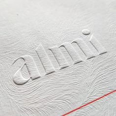 an image of the word gum written in white paper