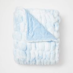 a blue and white blanket on a white background