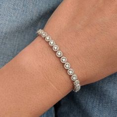 We took a classic tennis bracelet and added vintage charm with delicate milgrain detailing. The bracelet is finished with a box clasp with locking hinge for added security. This bracelet is fully customizable. If you prefer 18k gold or platinum, different dimensions, different quality diamonds or moissanites or colored gemstones, please contact us: http://etsy.me/1231fkN Details: - Solid 14k yellow or white gold - Bracelet is 7 inches in length. For different lengths, please contact us. - SI+G/H Classic Platinum Diamond Bracelet With Single Cut Diamonds, Classic Platinum Diamond Bracelet With Accents, Classic Platinum Diamond Bracelet, Classic Round Tennis Bracelet With Bezel Setting, Classic Jewelry With Single Cut Diamonds, Classic Tennis Bracelet With Bezel Setting, Classic Sterling Silver Bracelet With Prong Setting, Dainty Sterling Silver Tennis Bracelet For Formal Events, Dainty Sterling Silver Tennis Bracelet For Formal Occasions