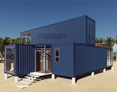 a blue shipping container sitting on top of a sandy beach next to palm trees and water