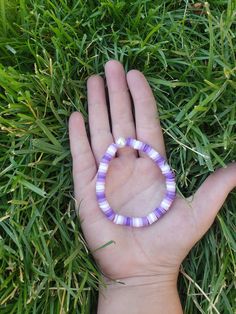 This cute purple bracelet is very cute and has a white pearl in it! It is very cute and durable. Handmade Purple Stretch Bracelet For Beach, Cute Handmade Purple Bracelets, Casual Purple Hypoallergenic Bracelets, Casual Purple Stretch Bracelet For Beach, Casual Purple Hypoallergenic Jewelry, Purple Beaded Bangle Bracelets For Friendship, Adjustable Purple Wristband With Round Beads, Cute Purple Hypoallergenic Bracelets, Adjustable Purple Pearl Bracelet Gift